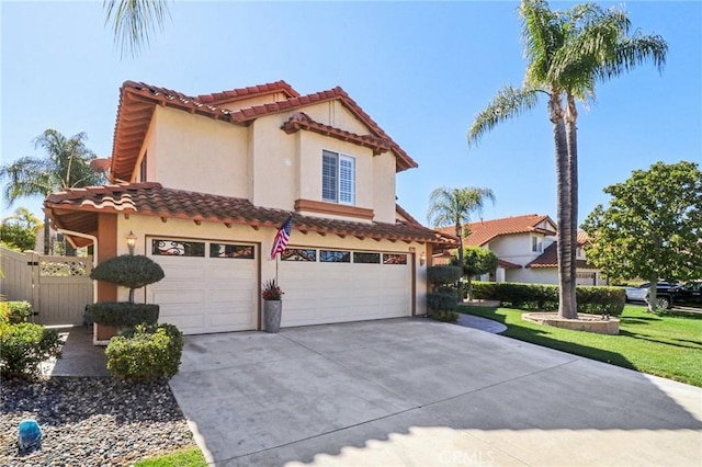 mediterranean / spanish-style home featuring a garage, a tile roof, concrete driveway, and stucco siding