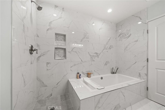 full bathroom featuring a tub with marble appearance and a marble finish shower