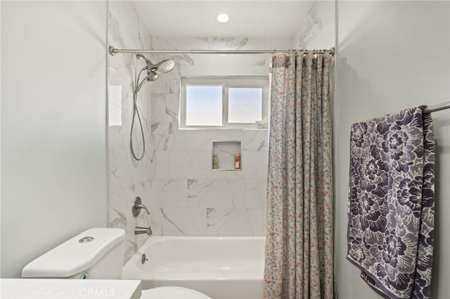 bathroom with toilet and shower / tub combo