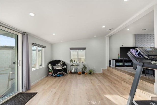 workout area featuring recessed lighting, baseboards, plenty of natural light, and light wood finished floors