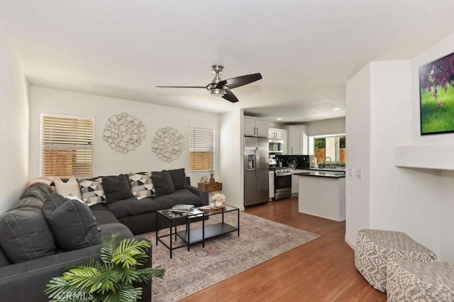 living area featuring recessed lighting, dark wood finished floors, and ceiling fan