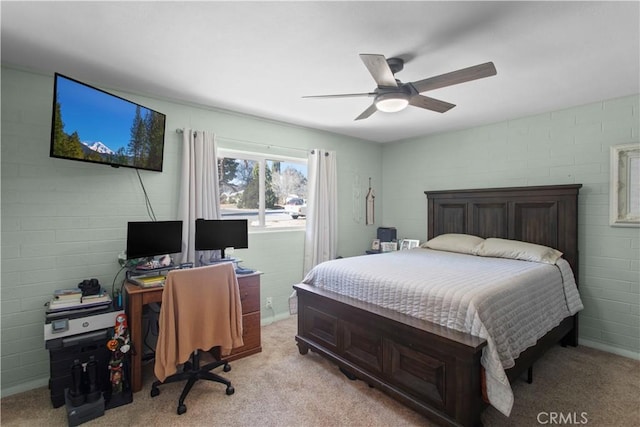 bedroom featuring light carpet and a ceiling fan