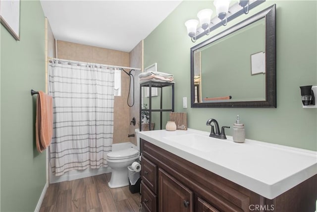 full bath featuring toilet, an inviting chandelier, shower / bath combo, vanity, and wood finished floors