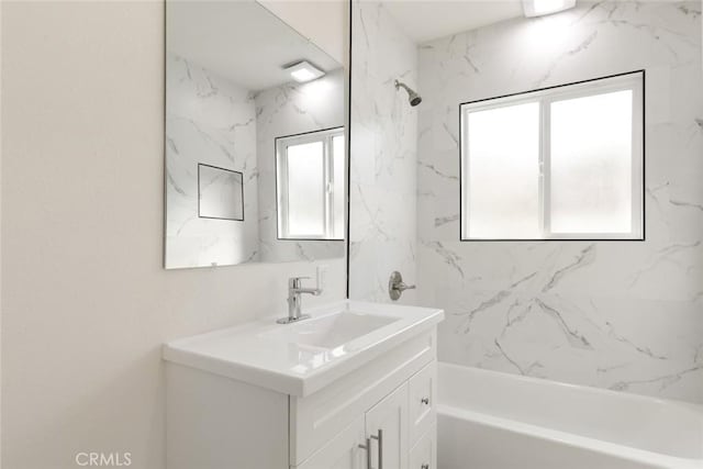 full bathroom featuring tub / shower combination and vanity