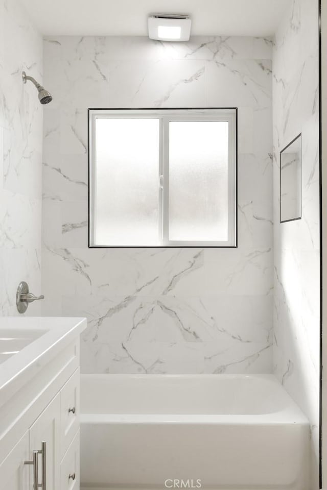 bathroom featuring shower / bathing tub combination and vanity