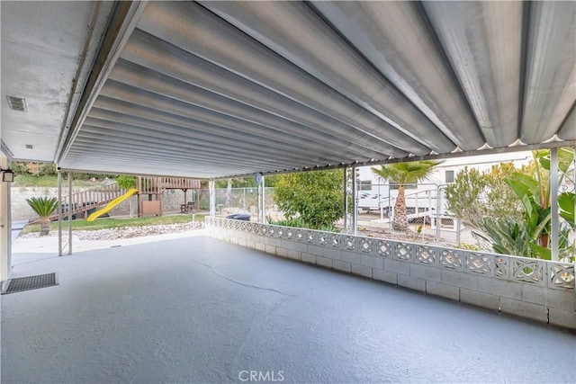 view of patio / terrace featuring a playground, fence, and visible vents