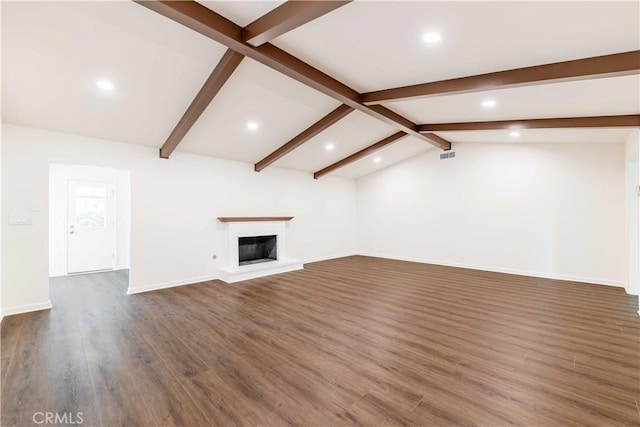 unfurnished living room featuring vaulted ceiling with beams, visible vents, baseboards, dark wood-style floors, and a glass covered fireplace