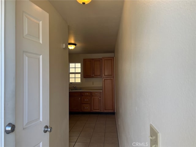 551 Hathway Ave, San Luis Obispo, CA 93405 - corridor with light tile patterned flooring and a sink