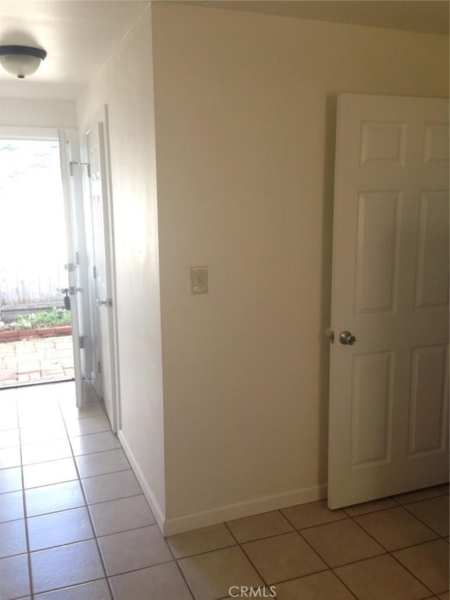 551 Hathway Ave, San Luis Obispo, CA 93405 - hallway featuring light tile patterned flooring and baseboards