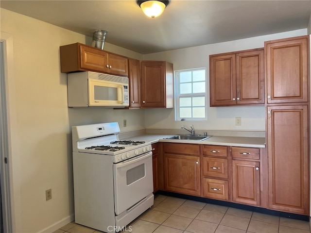 551 Hathway Ave, San Luis Obispo, CA 93405 - kitchen featuring white appliances, brown cabinets, light countertops, and a sink