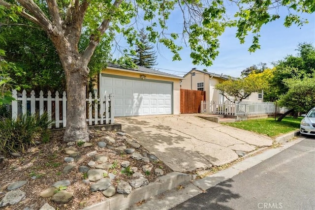 551 Hathway Ave, San Luis Obispo, CA 93405 - view of front of home featuring fence, stucco siding, concrete driveway, and an attached garage