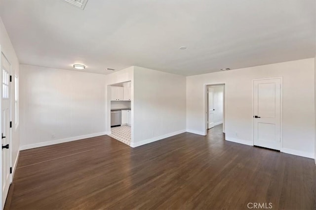 interior space with dark wood-style floors and baseboards