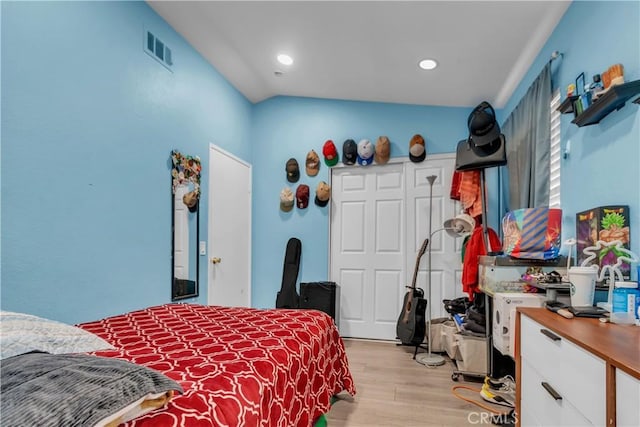 bedroom featuring light wood-type flooring, visible vents, and recessed lighting