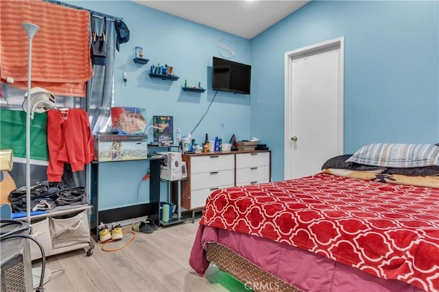 bedroom with light wood-style floors