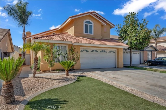 view of front of home featuring concrete driveway, a tile roof, and stucco siding