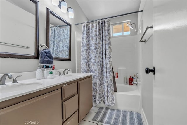 bathroom with shower / tub combo, tile patterned flooring, a sink, and double vanity