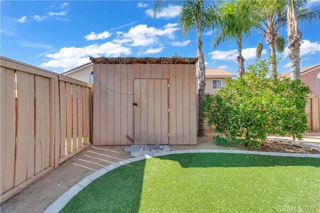 view of shed with fence