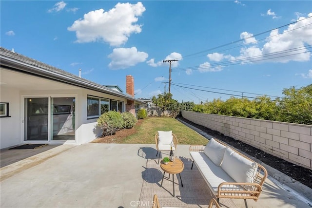 view of patio with a fenced backyard and an outdoor living space