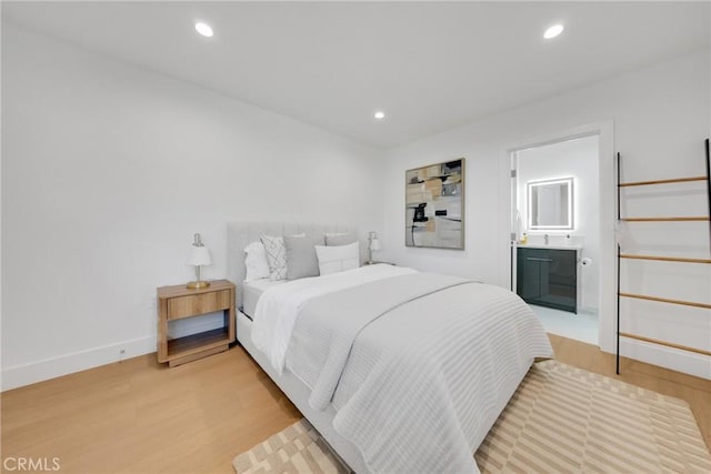 bedroom featuring light wood-style floors and recessed lighting