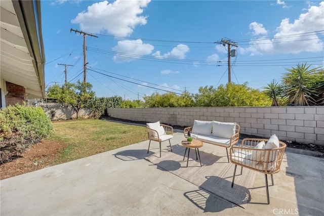 view of patio / terrace featuring an outdoor hangout area and a fenced backyard