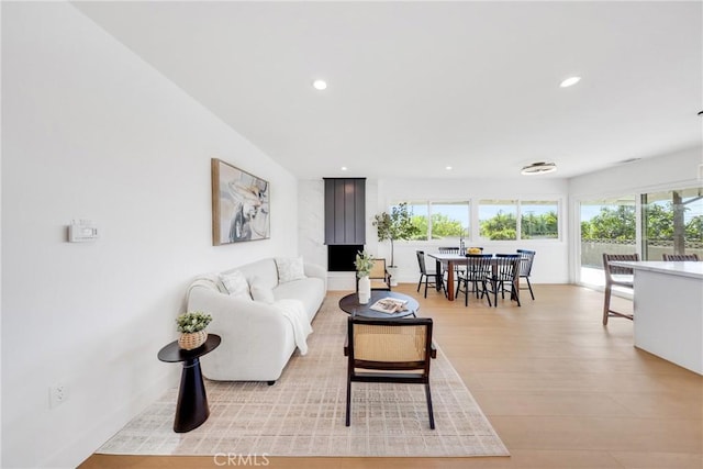 living area featuring recessed lighting and light wood-style floors