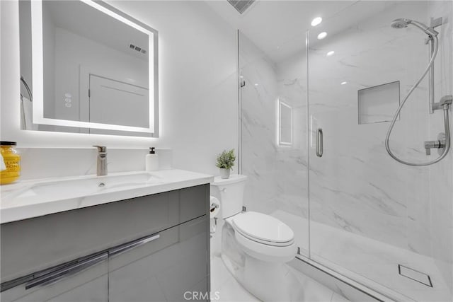 full bath featuring visible vents, a marble finish shower, toilet, and vanity
