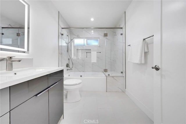 bathroom featuring bath / shower combo with glass door, vanity, toilet, and recessed lighting