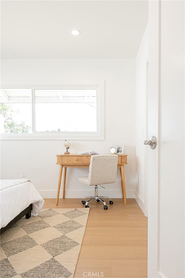 bedroom with light wood-style floors, recessed lighting, and baseboards