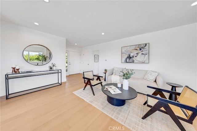 living room with recessed lighting and wood finished floors