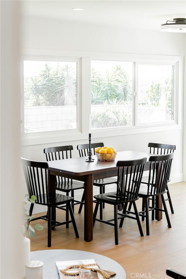 dining area featuring light wood-style flooring