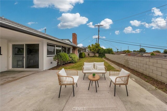 view of patio / terrace featuring a fenced backyard and an outdoor living space