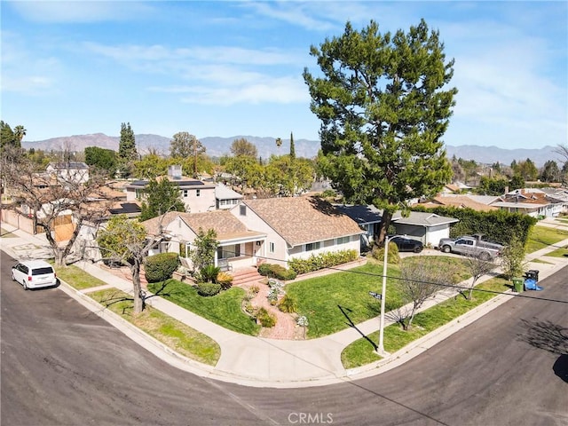 aerial view featuring a residential view and a mountain view