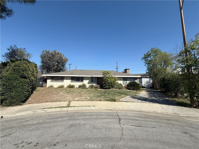 view of front facade with driveway and an attached carport