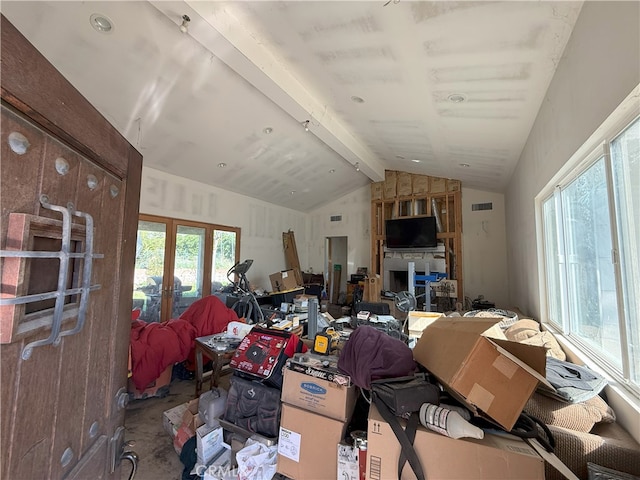 misc room featuring french doors, visible vents, and lofted ceiling with beams