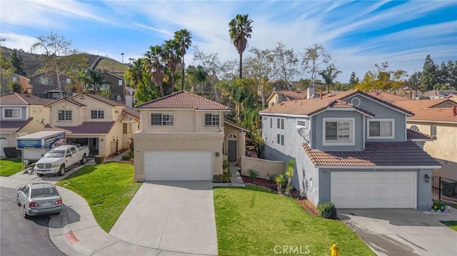 view of front of home featuring a residential view, a tile roof, and a front lawn