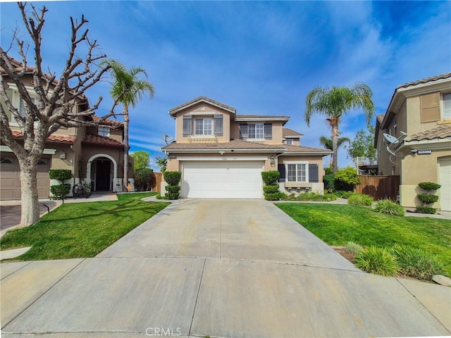 view of front of home with concrete driveway, a front lawn, an attached garage, and stucco siding