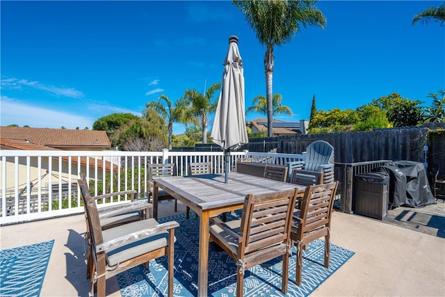 view of patio / terrace with outdoor dining area and fence