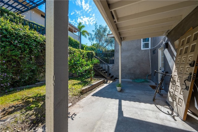 view of patio featuring stairs