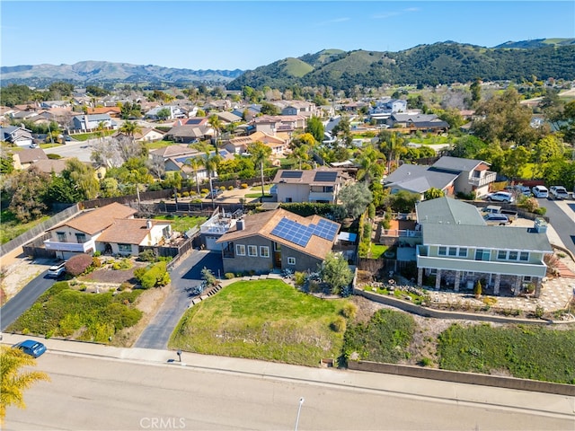 birds eye view of property with a mountain view and a residential view