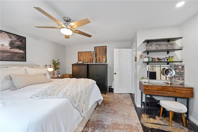 bedroom with baseboards and a ceiling fan