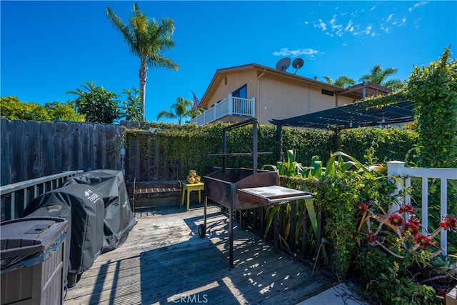 view of patio / terrace with a balcony and fence