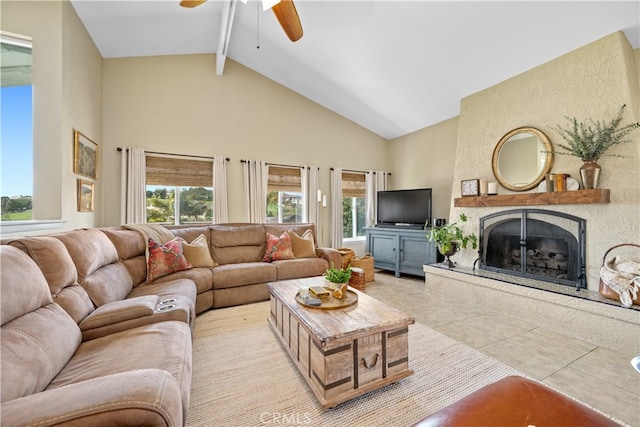 tiled living area with a large fireplace, plenty of natural light, high vaulted ceiling, and beamed ceiling