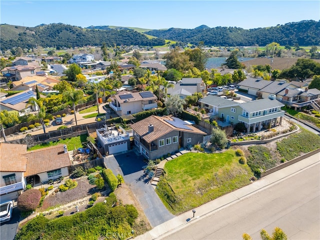 drone / aerial view featuring a residential view and a mountain view