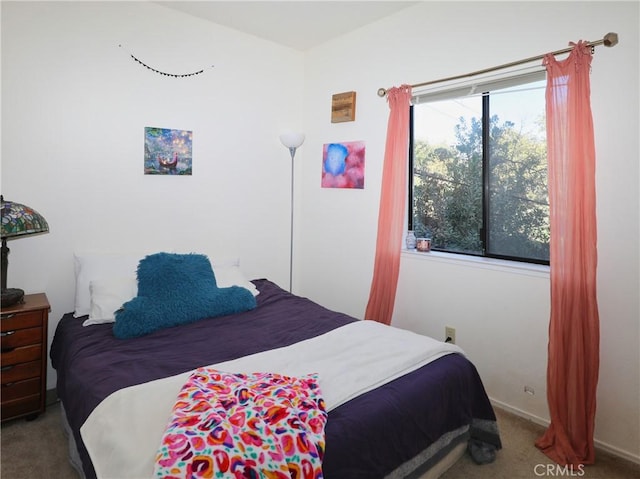 bedroom with carpet floors and baseboards