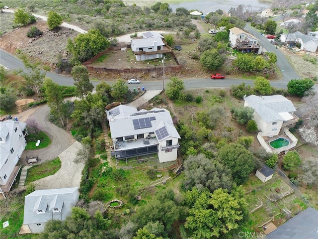 birds eye view of property with a residential view