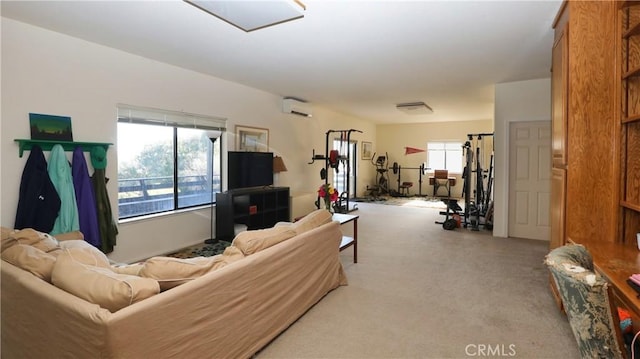 living room featuring light carpet and a wall mounted AC