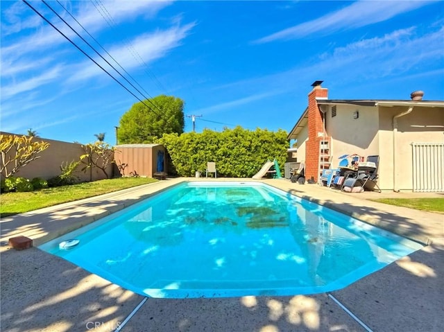 view of swimming pool with a fenced in pool, a patio area, and a fenced backyard