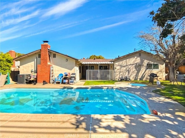 view of swimming pool with a fenced in pool and a patio