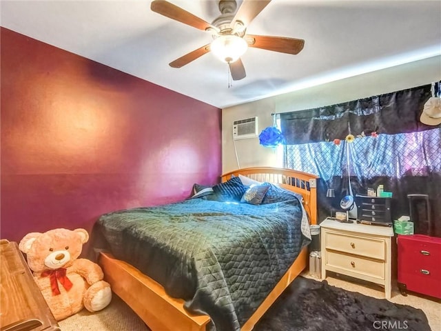 bedroom featuring carpet floors, a ceiling fan, and a wall mounted AC