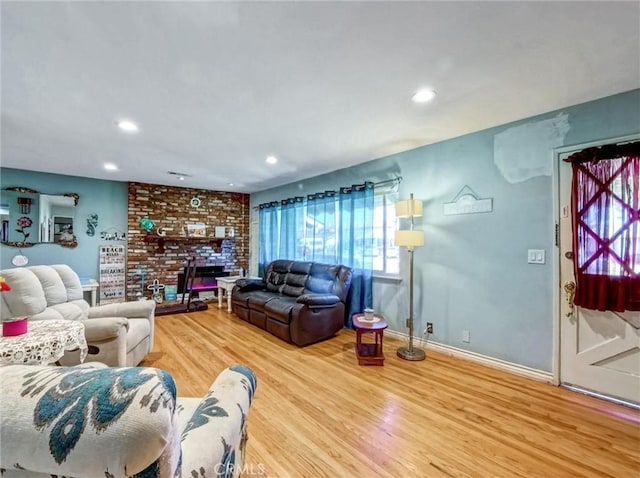 living room with recessed lighting, a fireplace, wood finished floors, and baseboards